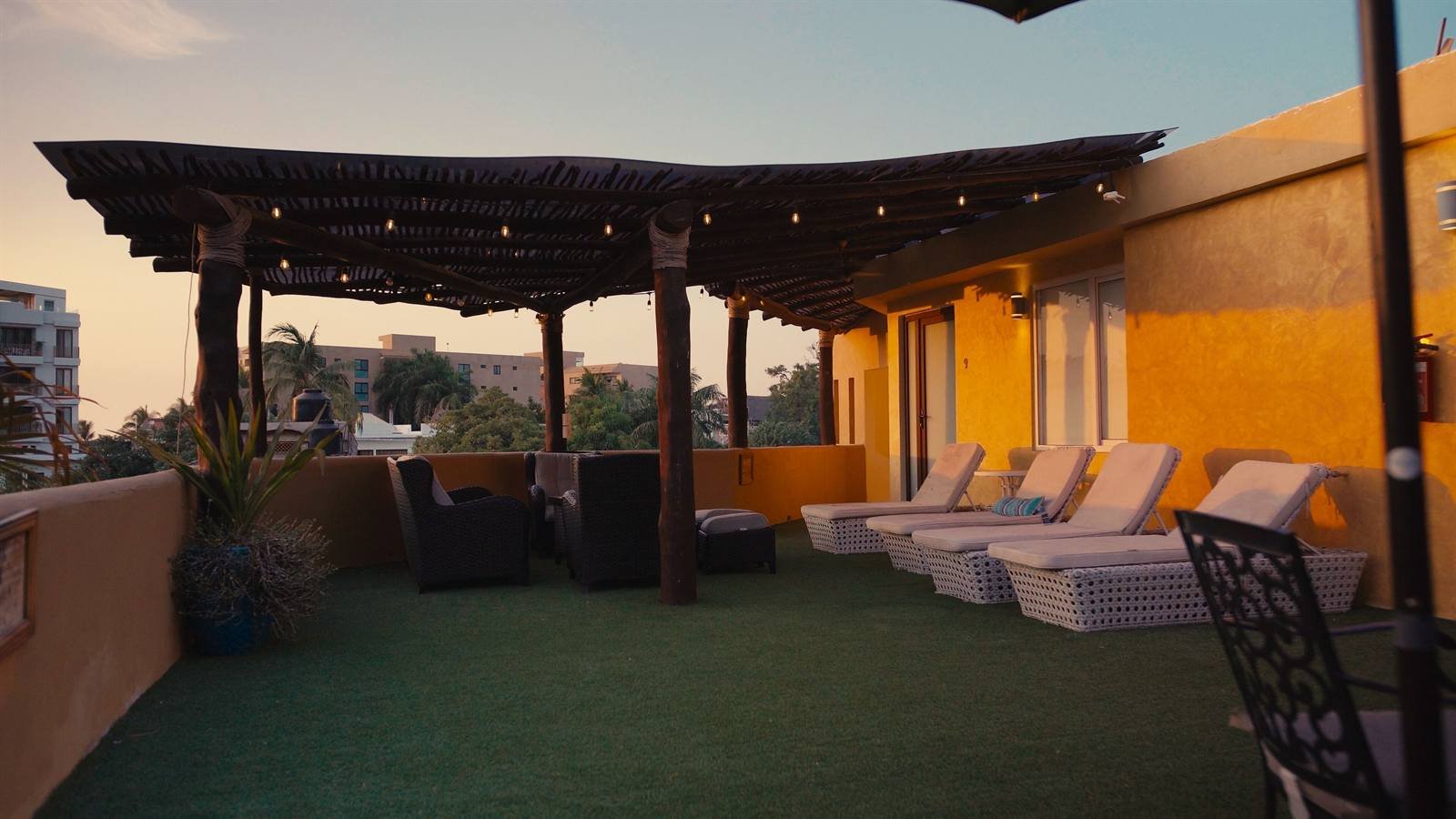 Casa Di Giulio: rooftop terrace with a pergola and lounge chairs
